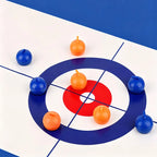 Tabletop Curling Game Set close view of eight orange and blue handled rollers on the white target mat