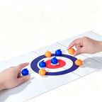 Tabletop Curling Game Set with two hands positioning blue and orange rollers around the red-and-blue target