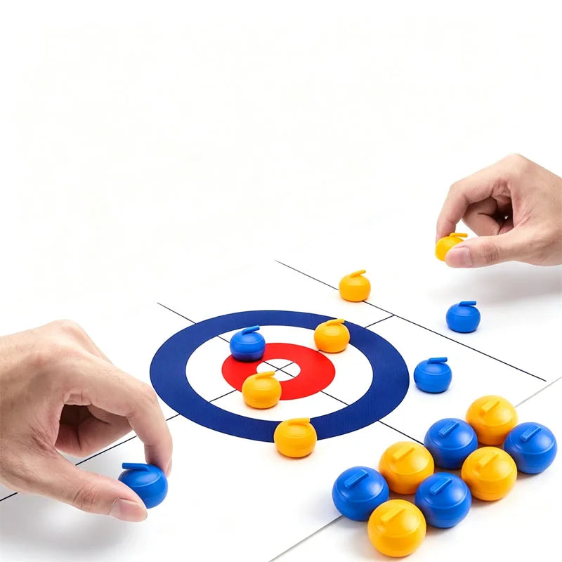 Tabletop Curling Game Set demonstration with two hands and additional blue and yellow rollers beside the mat
