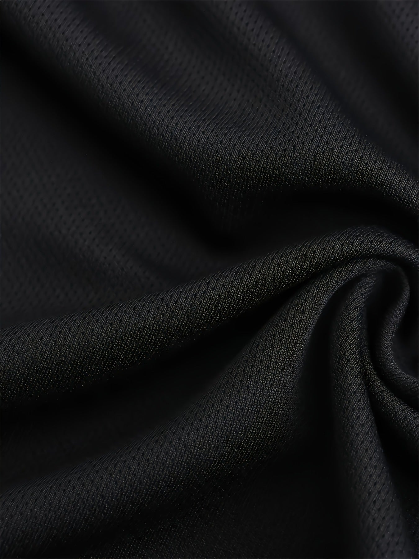 Taking Notes T-Shirt close-up of the black knit fabric texture and slight stretch