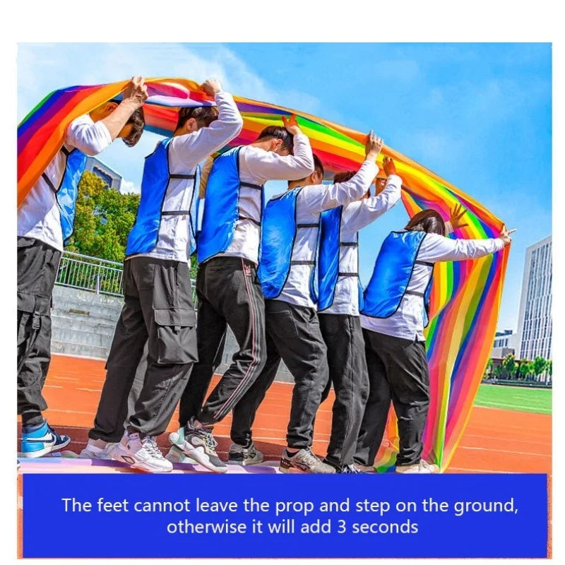 Team Building Race Mat: Players in blue vests walking inside a rainbow loop with a suggested time-penalty rule.