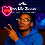HighPeak Thug Life Glasses in gold pixelated design worn by a man in blue hoodie with neon heart background