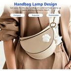 Touch Activated Bag Light — Paw and Star shapes shown as charms on a cream shoulder bag.