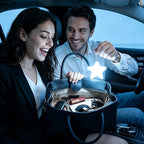 Touch Activated Bag Light — Star shape held above an open handbag by a couple seated in a car.