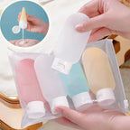 Travel Squeeze Bottle Set pastel bottles shown in a clear pouch with a handheld bottle and dispensing inset.