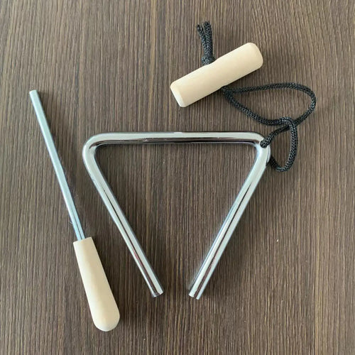 Triangle Instrument Set with silver triangle, black suspension cord and pale handles on a wooden table