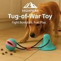 HighPeak Tug-of-War Toy in teal and pink with chew-resistant design and dog playing indoors on wooden floor
