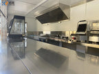 Example stainless steel container kitchen interior with ventilation hood and commercial cooking equipment