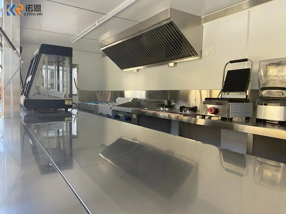 Example stainless steel container kitchen interior with ventilation hood and commercial cooking equipment
