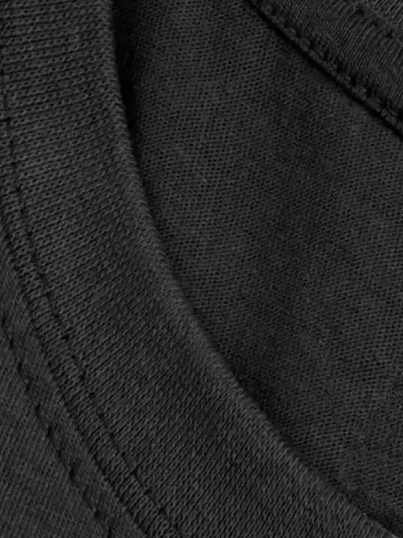 Under A Tack Tee close-up showing the texture of the black cotton knit fabric