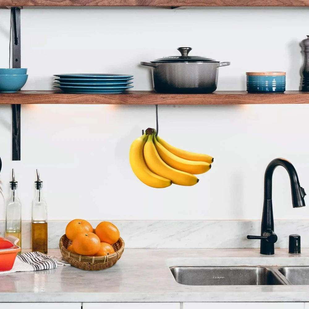 Under-Cabinet Banana Hook holding bananas beneath an open kitchen shelf near a sink and fruit basket