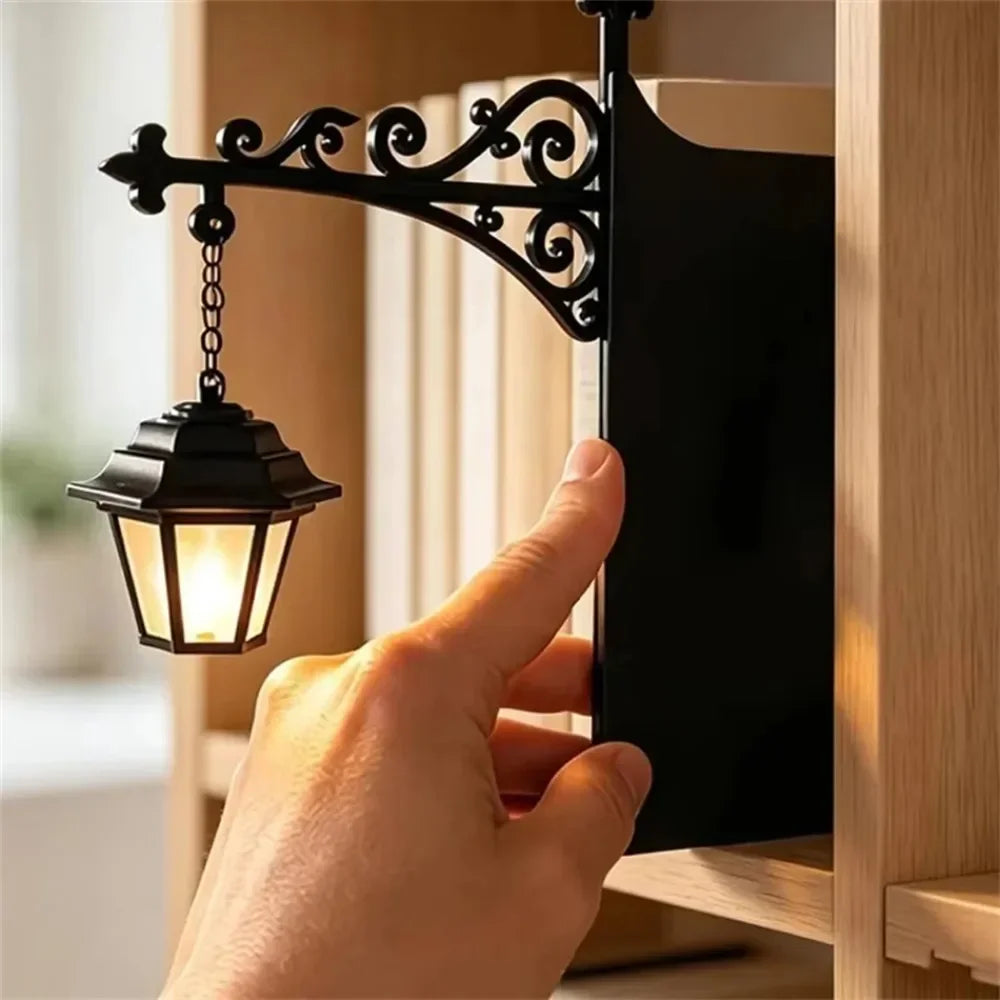 Vintage Bookshelf Lantern with a hand positioning the flat black backing between books on a wooden shelf
