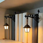 Vintage Bookshelf Lantern classic pair showing the warm glow against books and curled black brackets