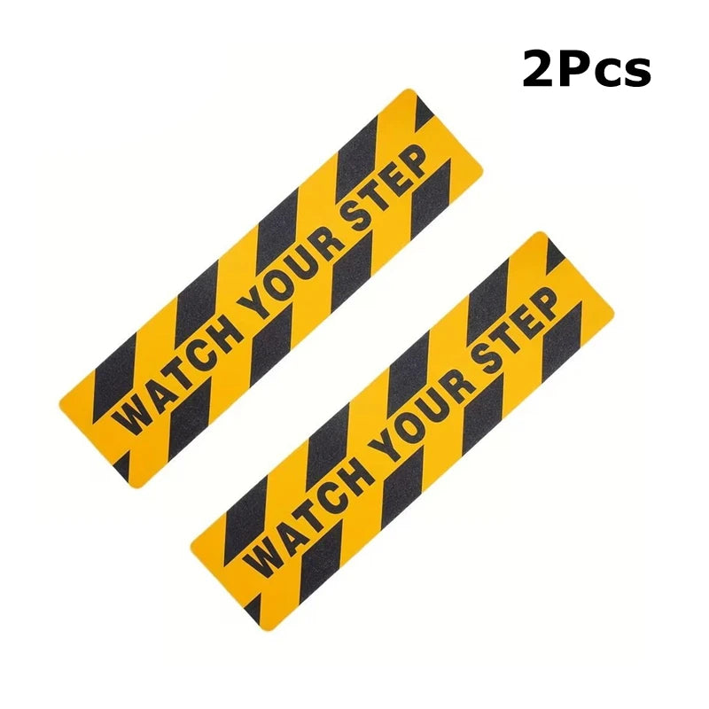 Watch Your Step Decals supplier example showing two black-and-yellow strips on a white background