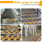 Watch Your Step Decals displayed on steps, an entry threshold and a factory walkway