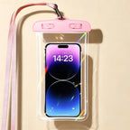 Waterproof Phone Pouch in pink holding a phone, with matching lanyard and clear front on a beige background.