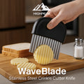 HighPeak WaveBlade™ stainless steel crinkle cutter knife slicing a potato chip with black no-slip handle on wood board