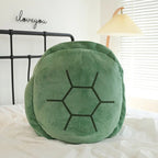 Wearable Turtle Shell Pillow green front view showing the complete stitched hexagonal shell
