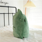 Wearable Turtle Shell Pillow green side profile showing its thick plush cushioning