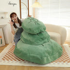 Wearable Turtle Shell Pillow green size options stacked vertically in a bright room