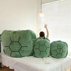 Wearable Turtle Shell Pillow green size options arranged together on a sofa for comparison