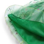 Winter Fairytale Princess Dress close-up showing the patterned sheer outer skirt and solid green layer underneath
