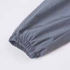 Women’s Reflective Joggers close-up of the gray elastic ankle cuff and its gathered stitching