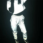 Women’s Reflective Joggers reflecting light in a standing outfit pose with a matching top and black sneakers