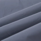 Women’s Reflective Joggers close-up showing the smooth gray fabric folded into soft diagonal ridges