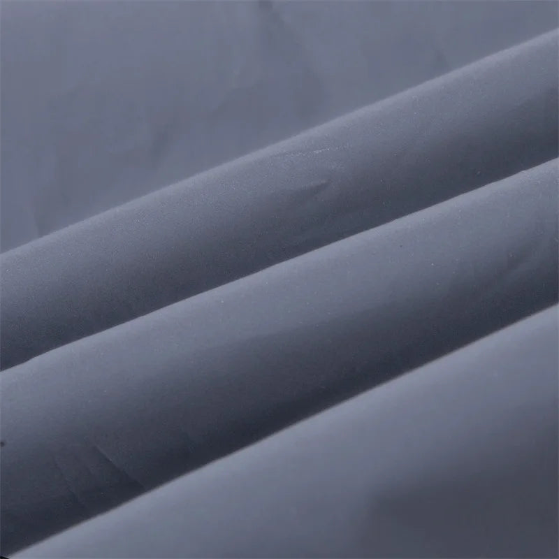 Women’s Reflective Joggers close-up showing the smooth gray fabric folded into soft diagonal ridges
