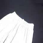 Women’s Reflective Joggers angled close-up of the waistband corner and stitching under direct light