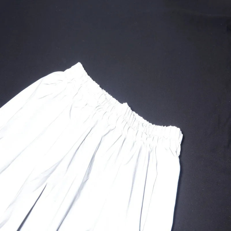 Women’s Reflective Joggers angled close-up of the waistband corner and stitching under direct light
