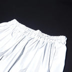 Women’s Reflective Joggers wide detail of the gathered waistband reflecting light on a black background