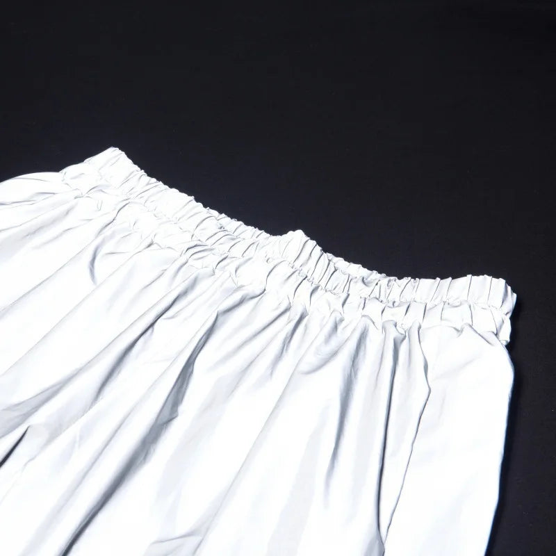 Women’s Reflective Joggers wide detail of the gathered waistband reflecting light on a black background