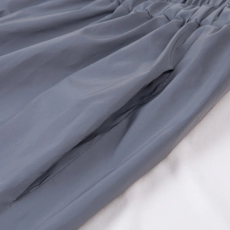 Women’s Reflective Joggers close-up showing a side pocket opening beneath the elastic waistband