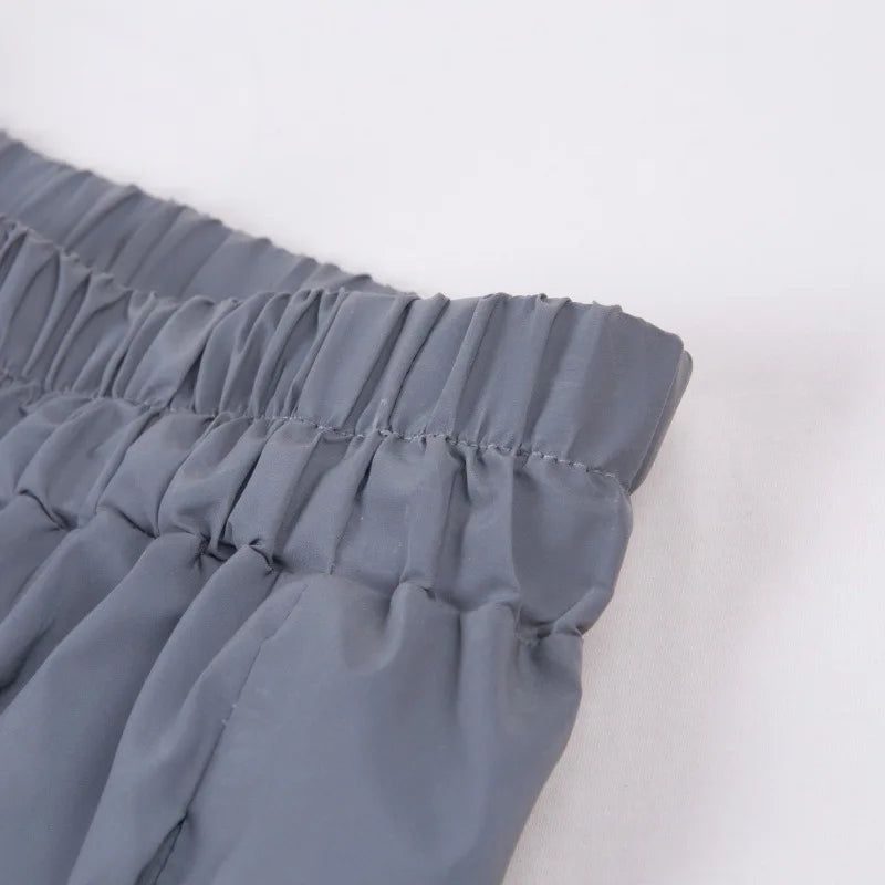 Women’s Reflective Joggers close-up of the gray gathered waistband and parallel rows of stitching