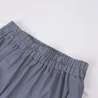 Women’s Reflective Joggers wide close-up of the gray elastic waistband against a white background
