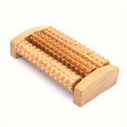 Wooden Foot Massage Board showing textured wooden rollers and curved end supports on a white background
