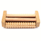 Wooden Foot Massage Board underside showing wooden support bars, frame ends, and a textured roller