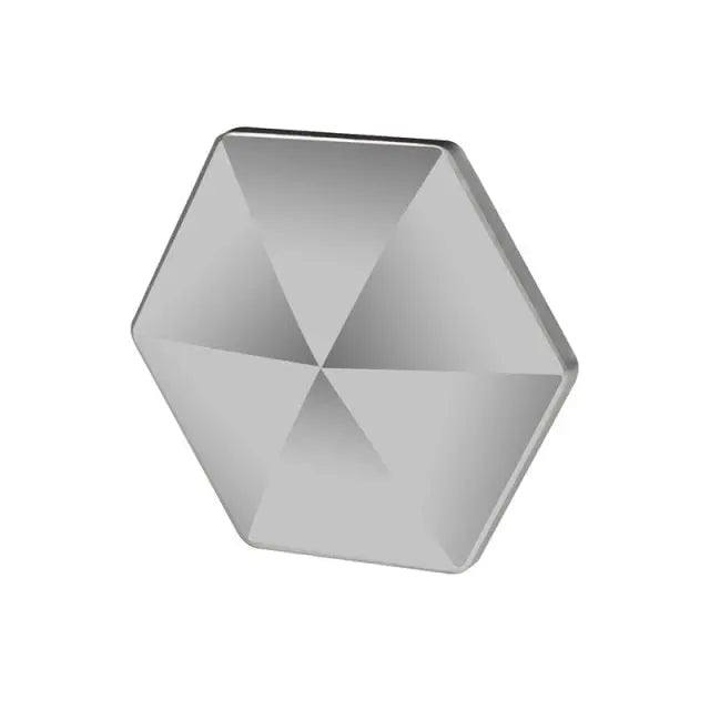 HexFlip fidget toy in sleek silver metallic finish with hexagonal design and geometric facets for desk flipping entertainment