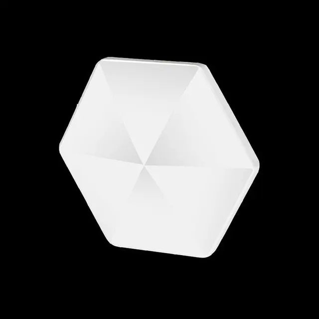 HexFlip fidget toy in white hexagonal design with radial pattern on black background - stress relief desk accessory