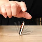 HexFlip metal fidget spinner in spinning motion on wooden surface - demonstrating flip action and desk-friendly design