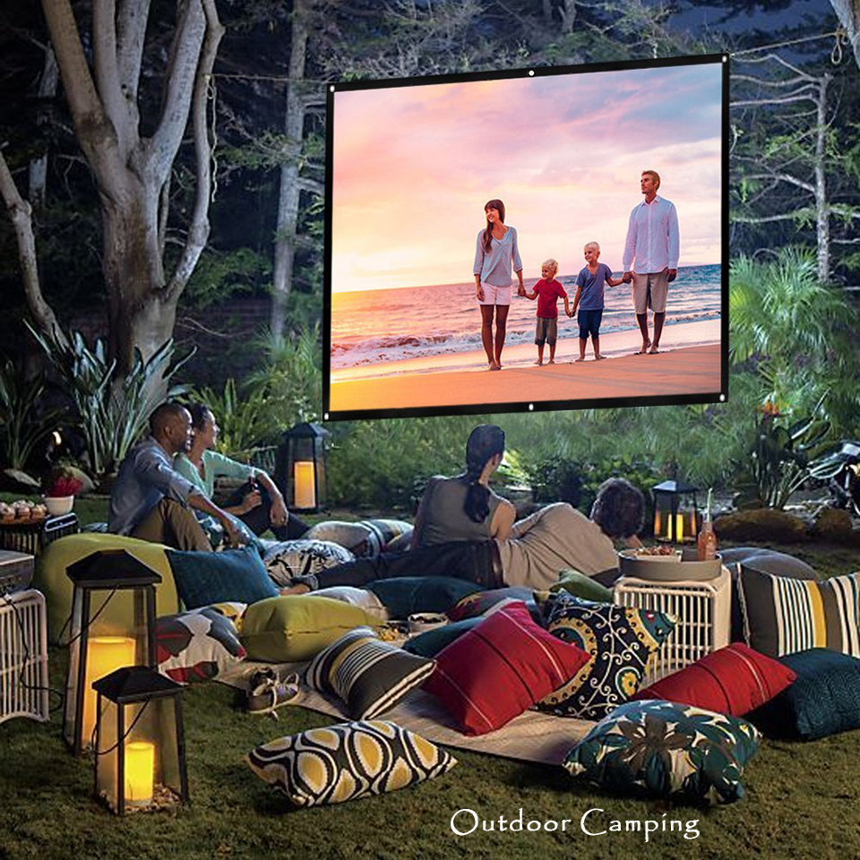 HighPeak Movie Screen displaying sunset scene during outdoor movie night with cozy pillows and lantern-lit garden setup