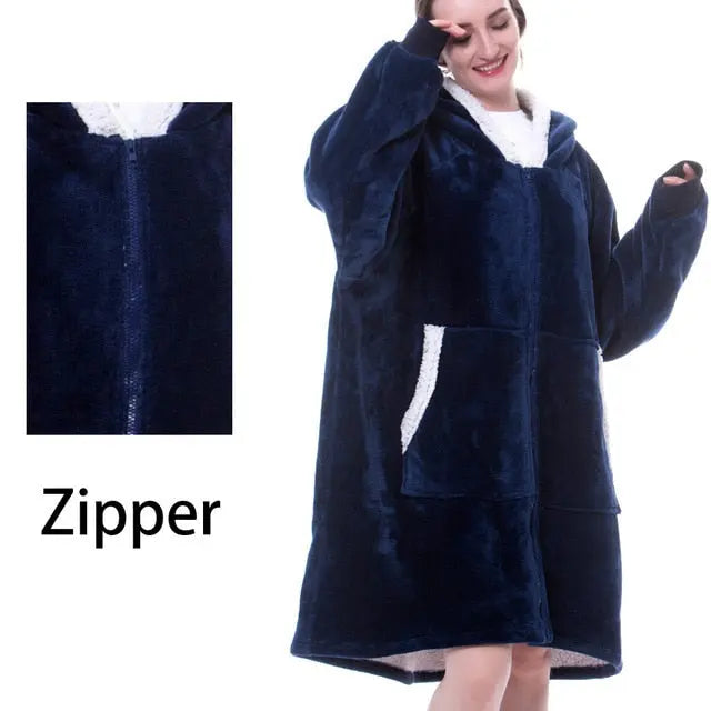 Navy blue Oversized Hoodie Blanket with sherpa lining and front zipper closure, worn comfortably as wearable blanket with front pocket