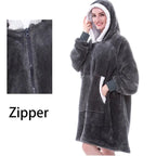 Oversized Hoodie Blanket in charcoal grey with sherpa-lined hood and zip front, featuring cozy microfiber material and front pocket