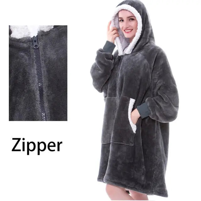 Oversized Hoodie Blanket in charcoal grey with sherpa-lined hood and zip front, featuring cozy microfiber material and front pocket