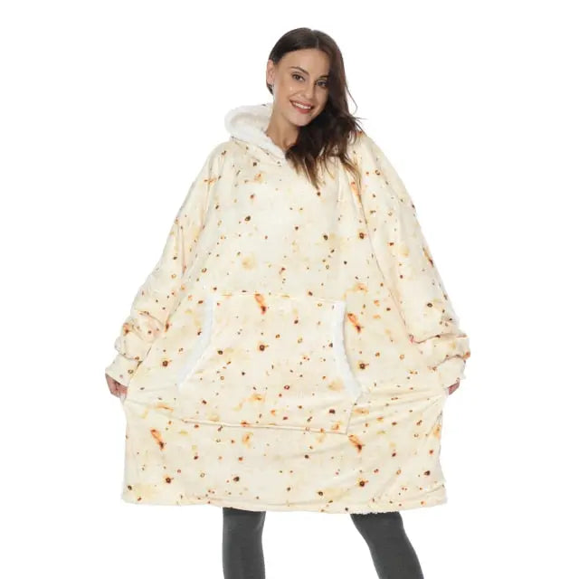 Oversized Hoodie Blanket in cream color with burrito print pattern worn by model, showcasing cozy sherpa-lined design and spacious fit