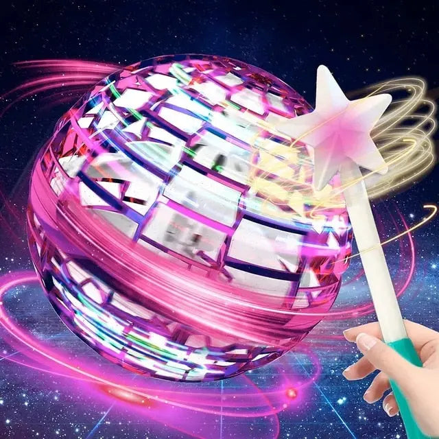 RoboFly flying orb toy in pink with glowing LED lights and protective cage design against starry space background